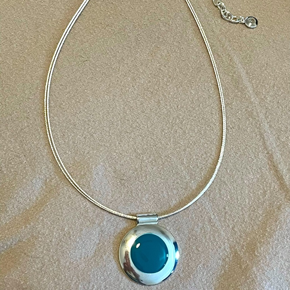 Silver tone necklace with blue pendant